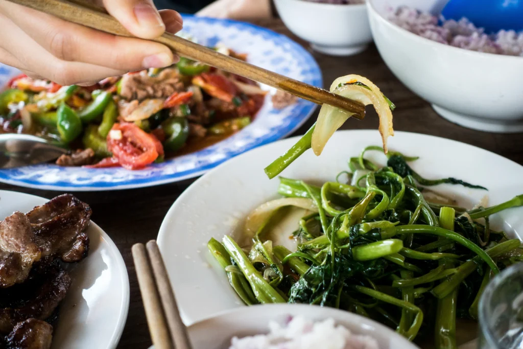 Traiteur Chinois Caen - eating-vietnamese-spinach-with-chopsticks-2023-11-27-05-15-00-utc -  (151)